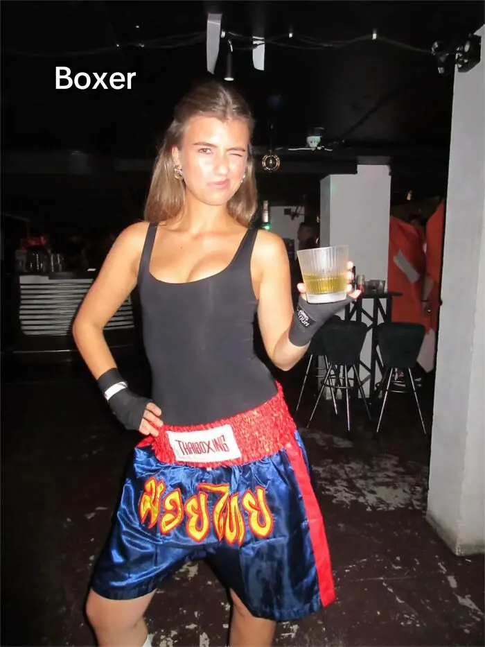A woman in boxing shorts and hand wraps as a quick boxer Halloween costume idea.