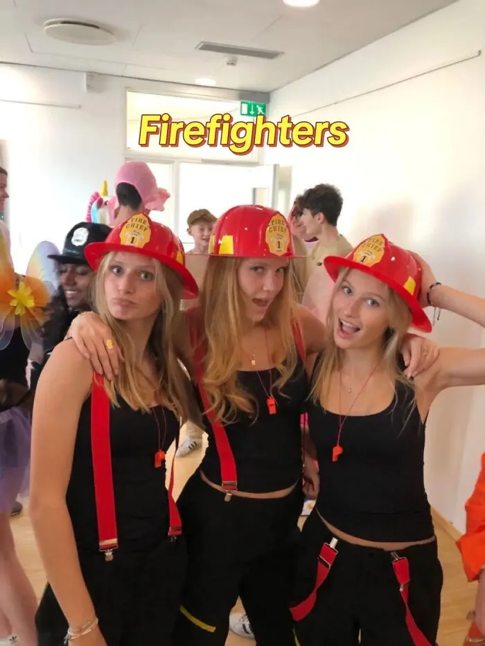 Three friends dressed up in matching firefighter outfits as cool Halloween costume ideas.