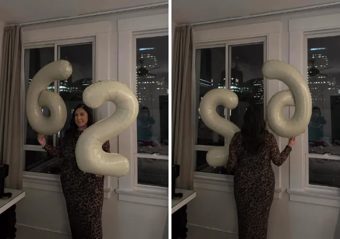 A woman holding birthday balloons flipped around by a photoshopper to show 29 instead of 62