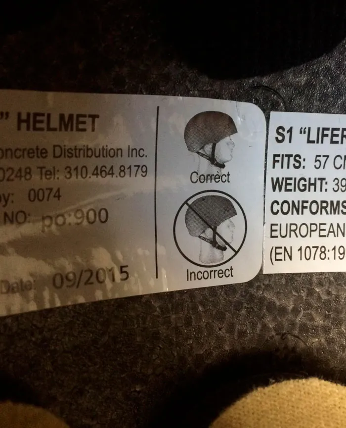 Helmet safety sticker with confusing labels and instructions showing identical pictures for correct and incorrect.
