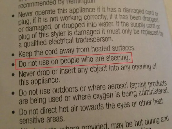 Safety manual with hilariously confusing instructions warning not to use appliance on sleeping people.