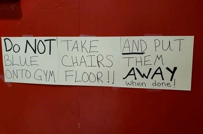 A sign with confusing labels that can be read in multiple wrong ways about gym chairs.