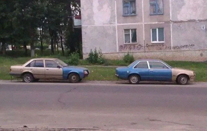 Example of Slavic engineering with two cars swapping mismatched body panels.