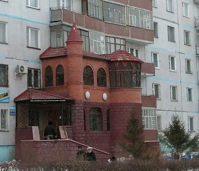 An apartment building balcony transformed into a brick castle, a creative example of Slavic engineering.