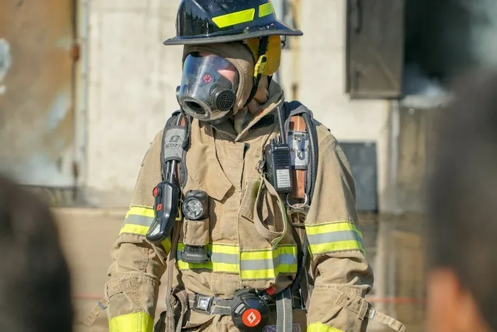 A firefighter standing in full gear, representing unique dumpster finds salvaged from local places.