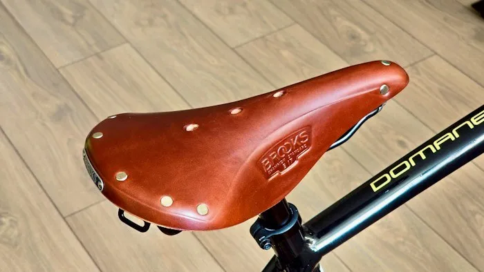 Close-up of a high-quality leather Brooks bicycle saddle found while dumpster diving.