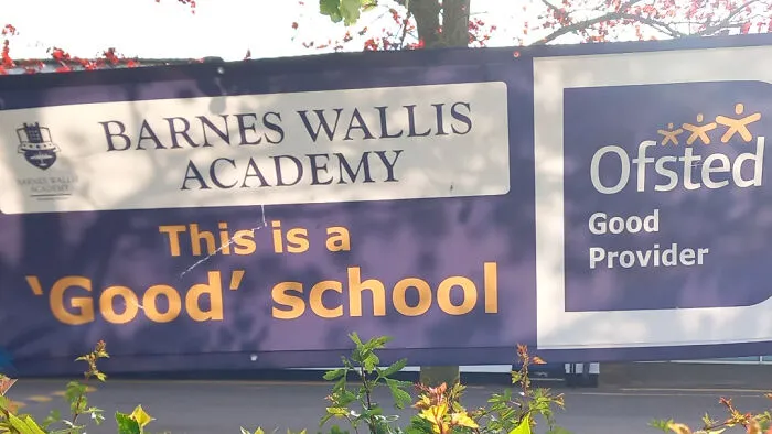 A school sign with misused quotation marks around the word good in this is a good school.