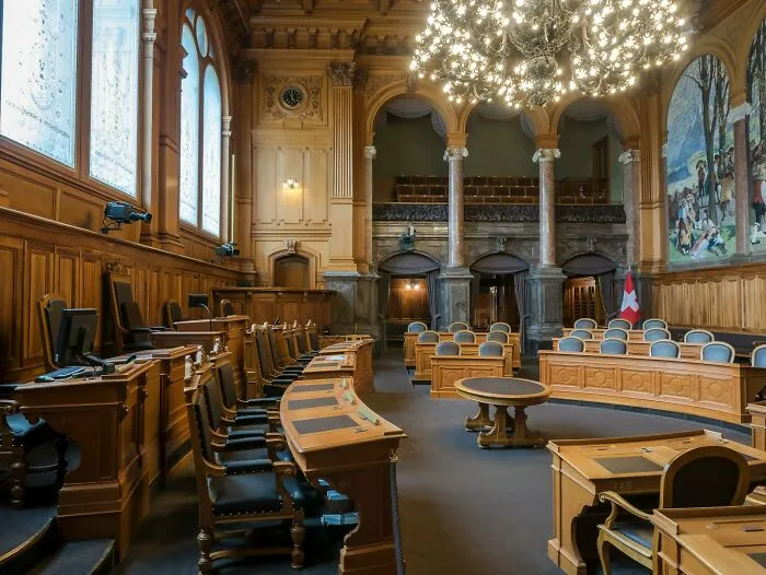 A grand, empty courtroom setting where severe relationship fights are settled