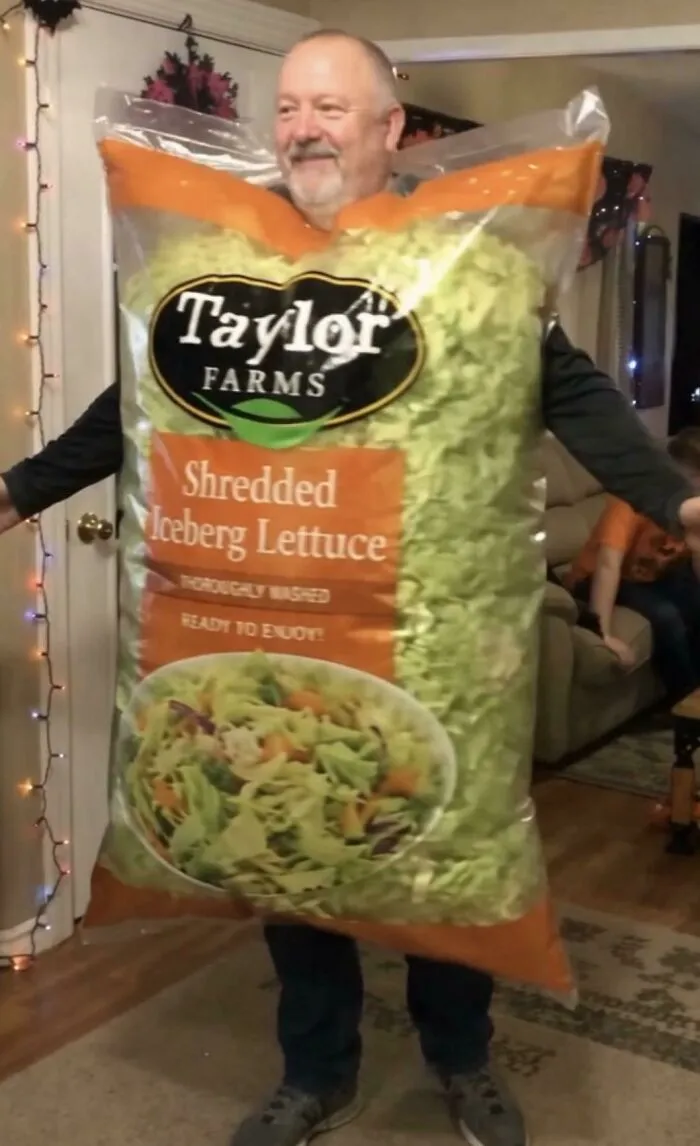 A person dressed as a bag of shredded iceberg lettuce as creative Halloween costume ideas.