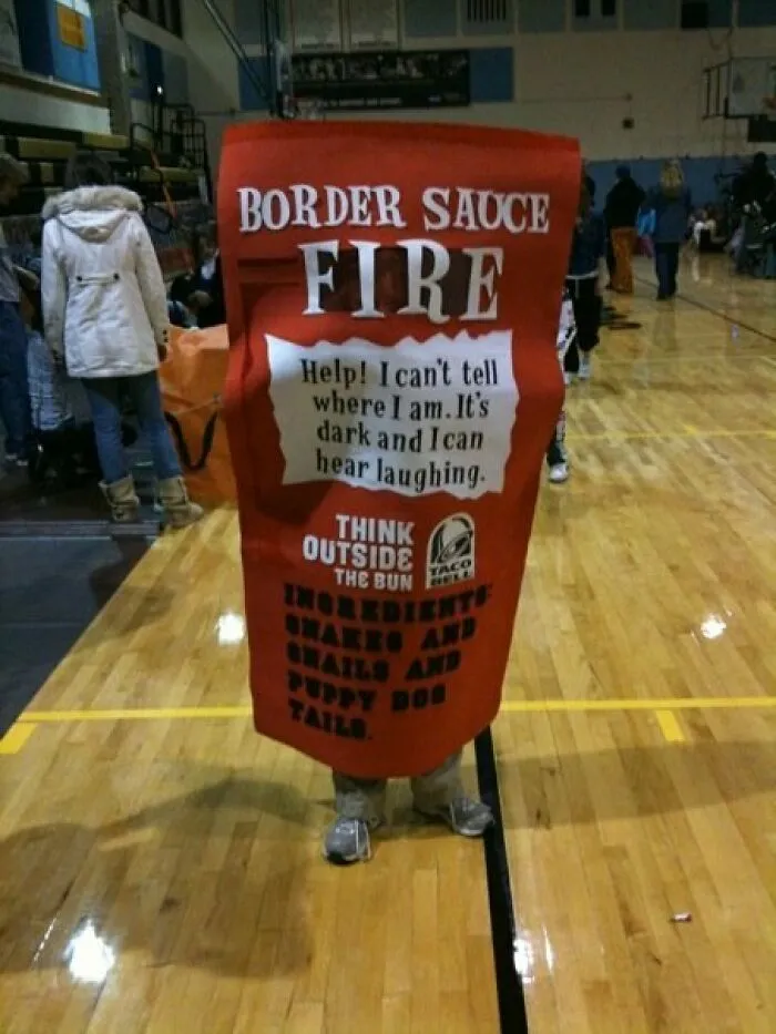 Person wearing a giant hot sauce packet outfit as a creative Halloween costume idea