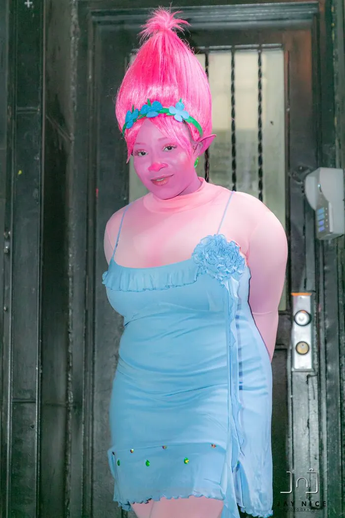Person dressed in a colorful Troll character outfit for creative Halloween costume ideas.