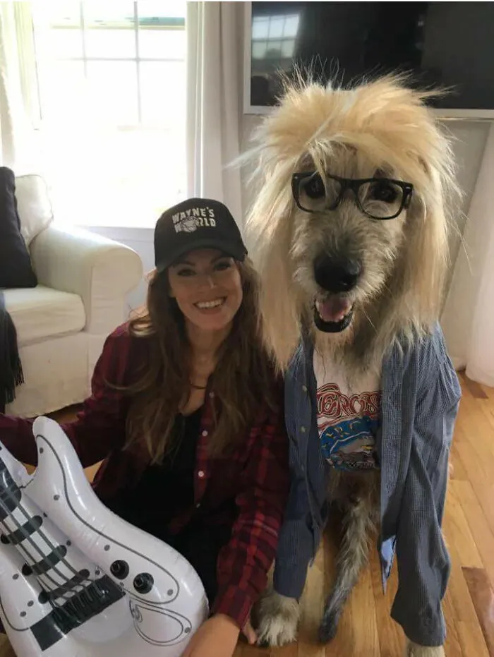 A woman and her large dog dressed up in a Wayne's World duo pet halloween costumes concept