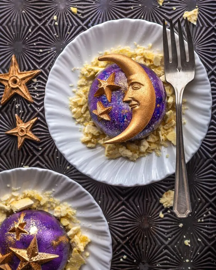 Celestial themed purple and gold dessert shaped like a crescent moon and stars served as Halloween foods.