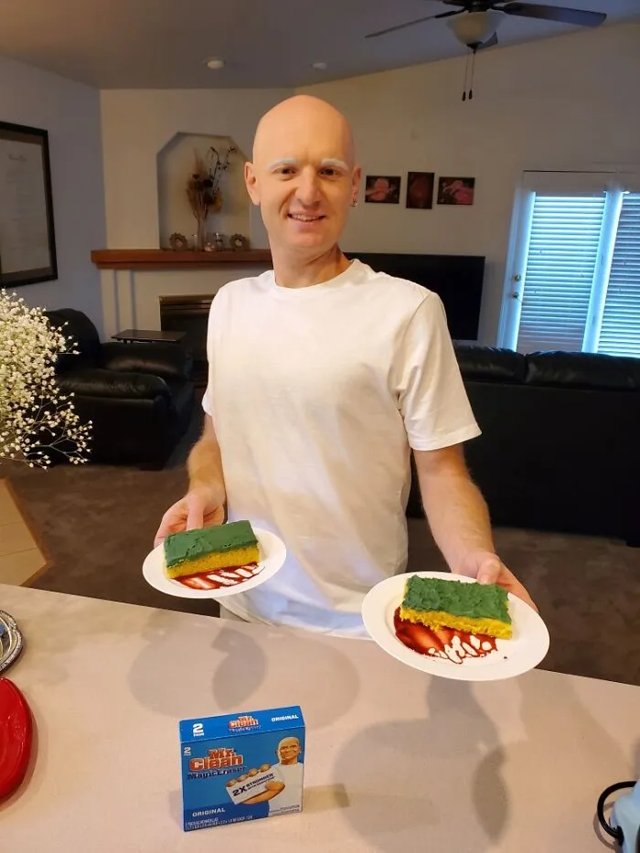 Man dressed as Mr. Clean holding sponge-shaped cake slices for creative Halloween foods.