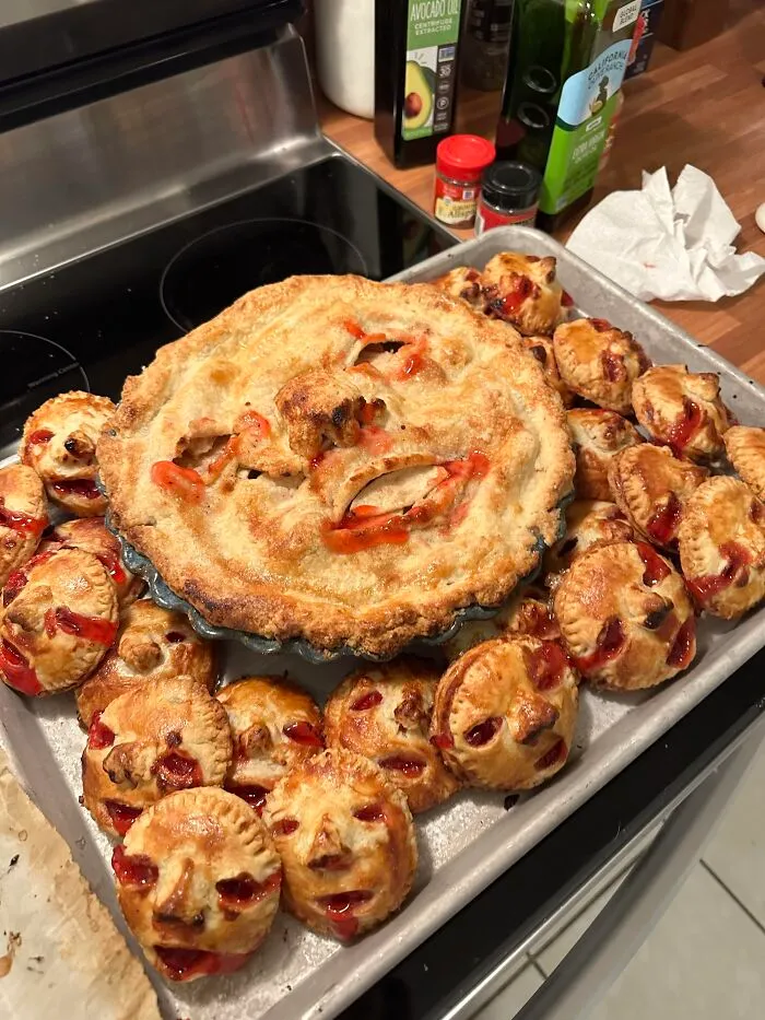 Cherry pie and mini pastries crafted to look like creepy screaming faces for spooky Halloween foods.