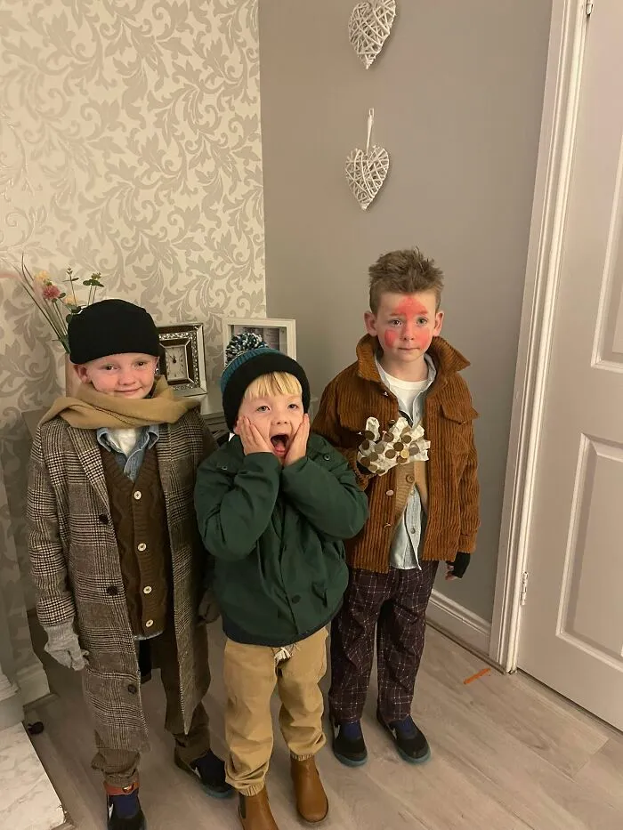 Three kids dressed in Home Alone movie Halloween costumes
