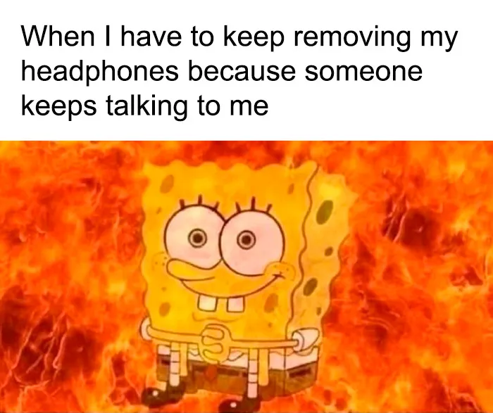 SpongeBob surrounded by fire showing frustration of removing headphones meme