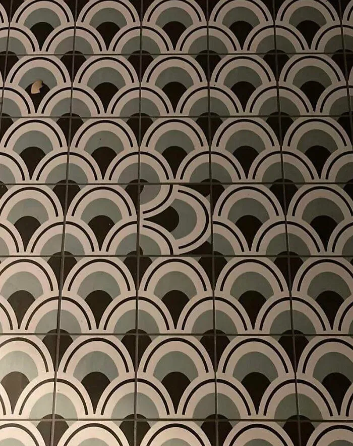 A home renovation tiling fiasco where a single patterned tile is rotated the wrong way.