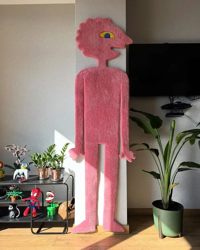 Quirky pink character wall rug added to a room for a fun home makeover
