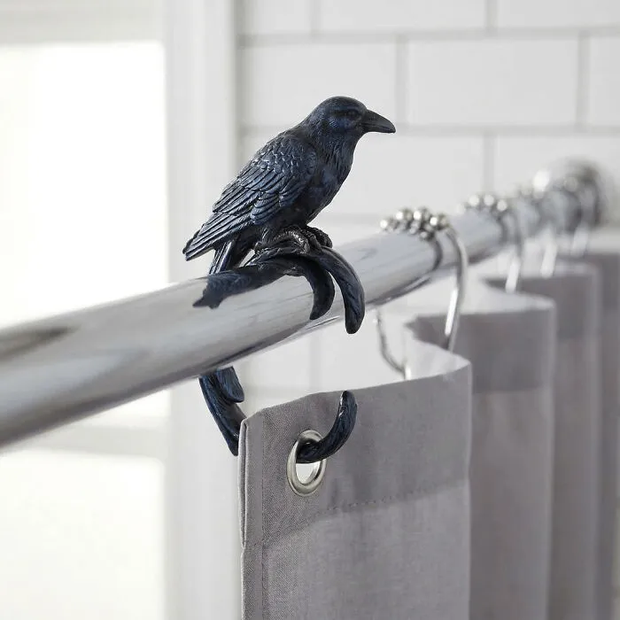 Black crow shower curtain hook adds a subtle Halloween theme.