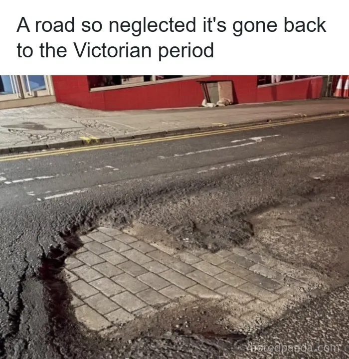 Pothole in modern asphalt road revealing old cobble paving beneath as interesting facts about the world