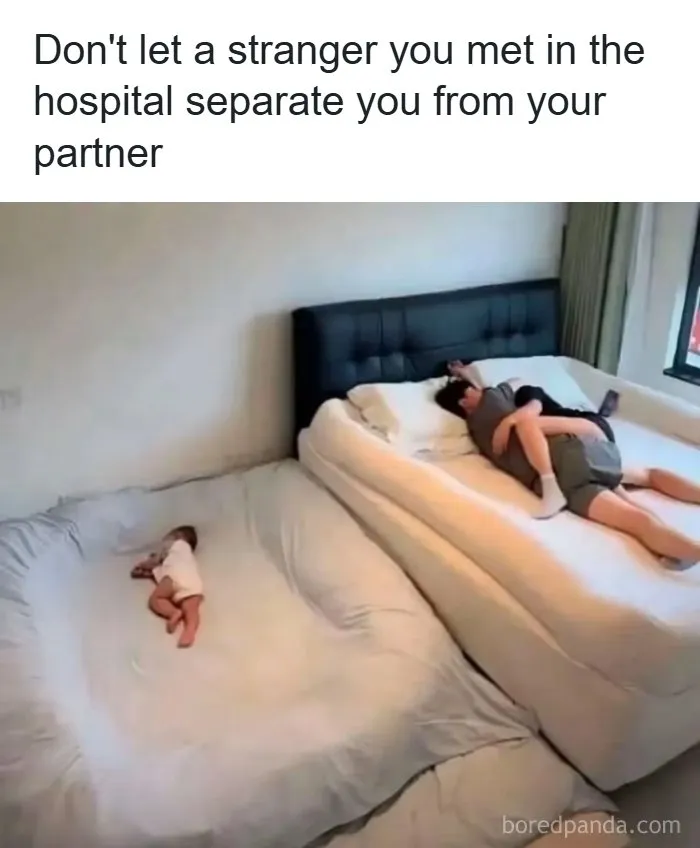 Wholesome memes image showing a couple cuddling in bed while a baby sleeps separately on the floor mattress.