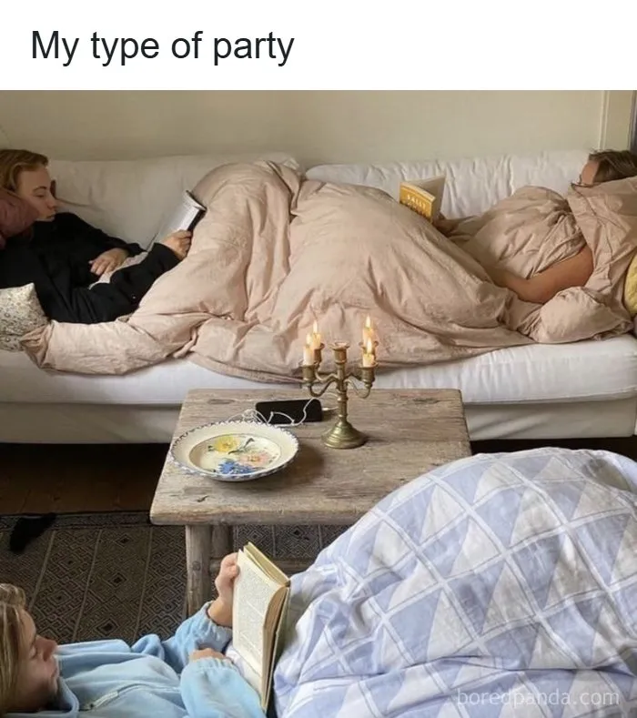 Three people reading books covered with blankets at a cozy book party