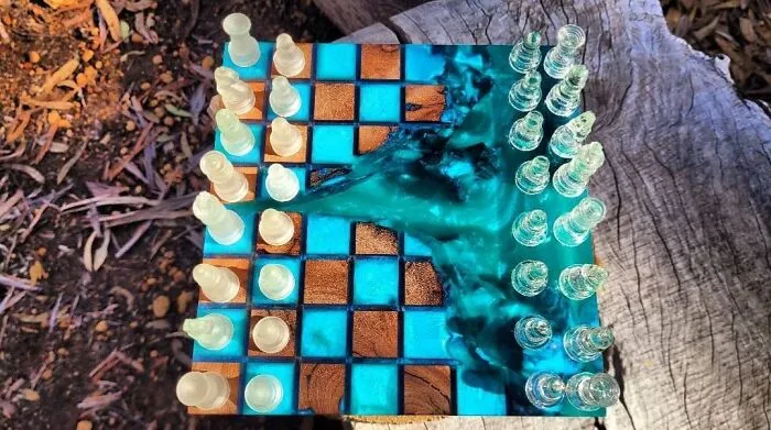 An artistic chess set made of epoxy resin and wood, showcasing clever wooden creations