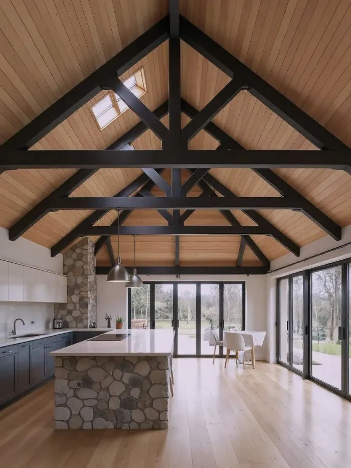 High vaulted ceiling with dark wooden beams, showcasing clever wooden creations