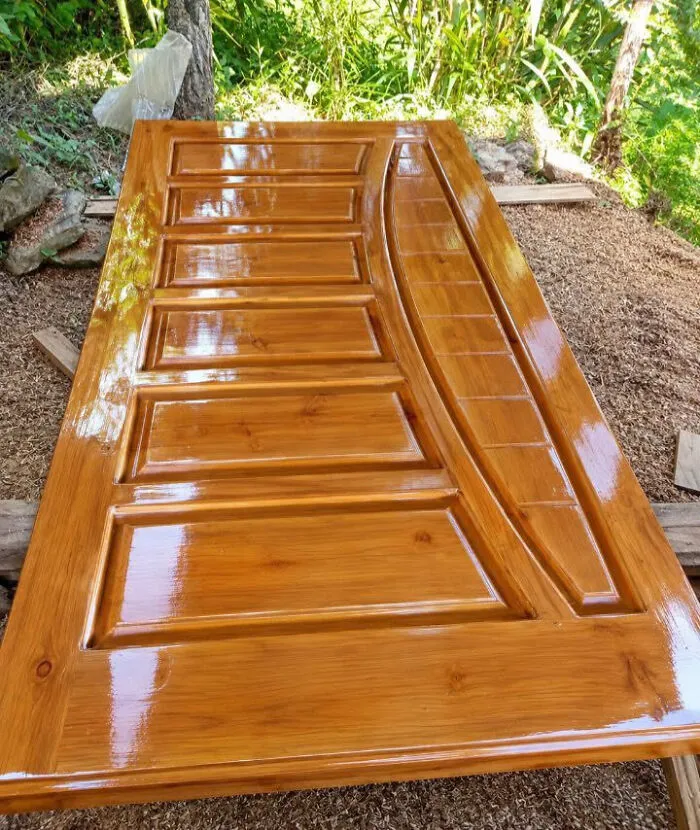 Glossy varnished wooden door, one of many clever wooden creations