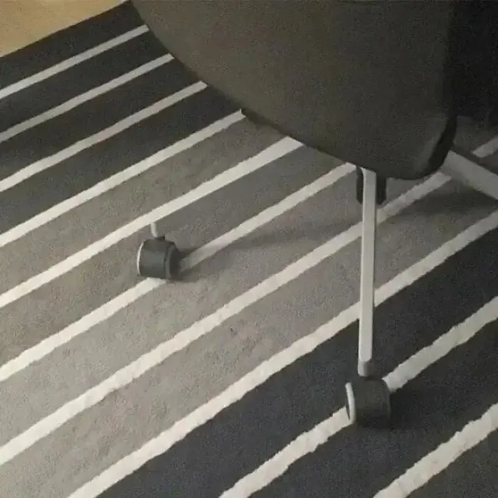 Transparent look of an office chair leg blended with striped rug in confusing photos.