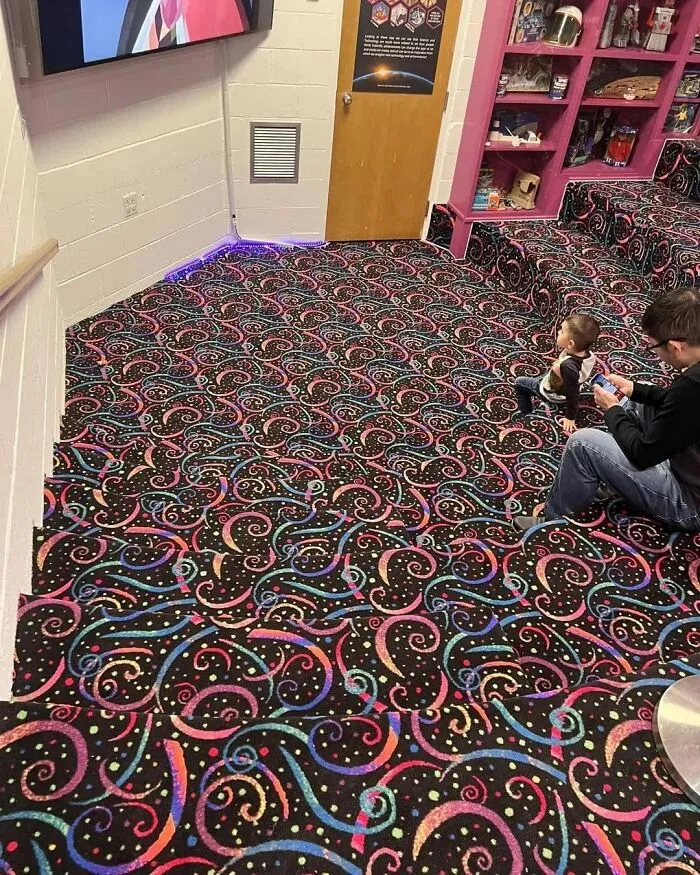 Patterned carpeted stairs creating a confusing visual trick for eyes