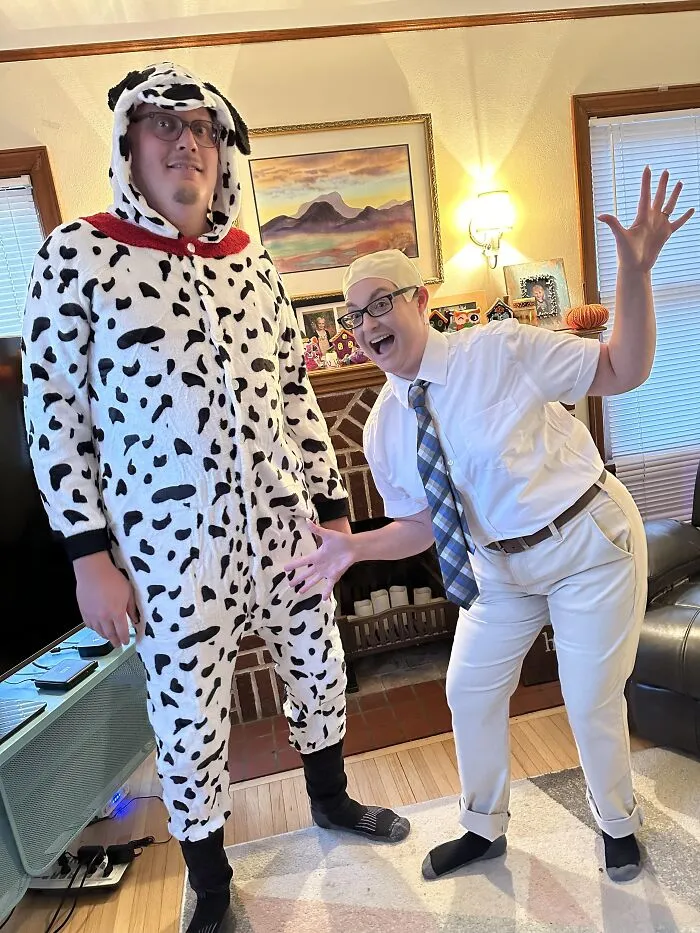 A person in a dalmatian suit and a person in a office shirt present funny Halloween couples costumes