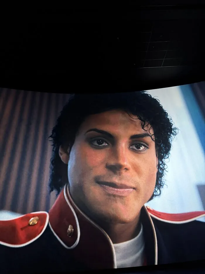 A curved TV screen displaying a distorted face that plays tricks on your eyes
