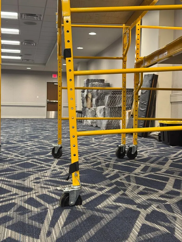 Yellow scaffolding wheels that might make you wonder if your eyes are playing tricks on you