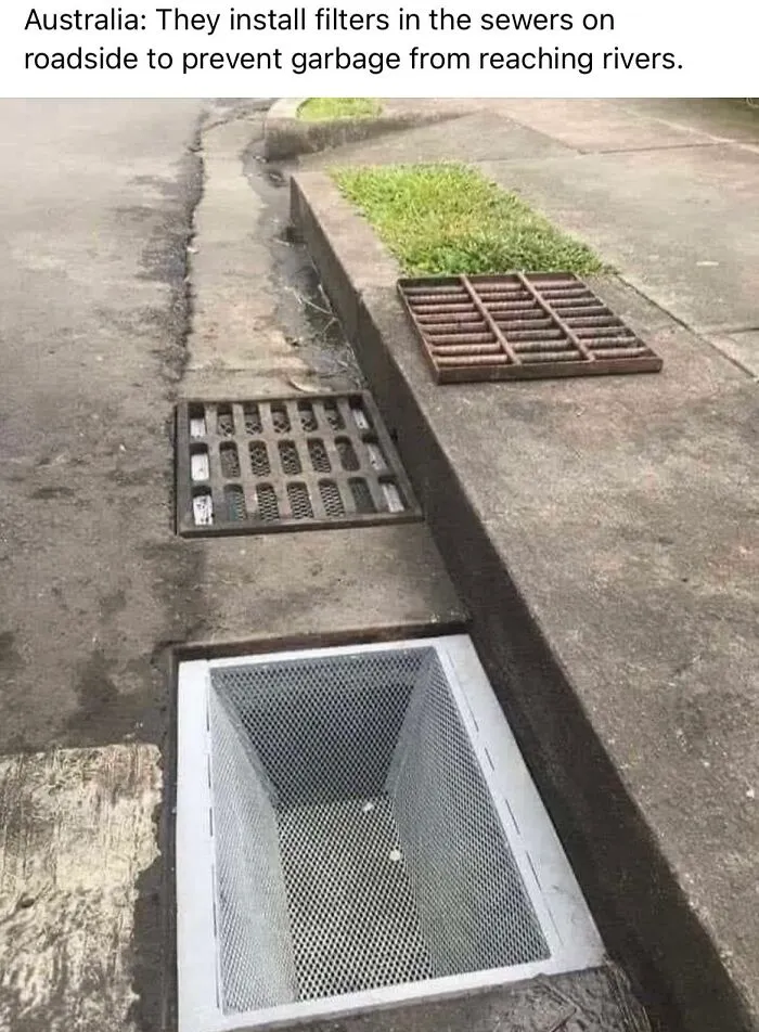 A roadside storm drain with a mesh filter basket installed to capture trash