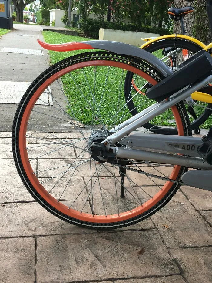 Ingenious things: bicycle wheel design featuring airless, puncture-proof rubber tires on a path.