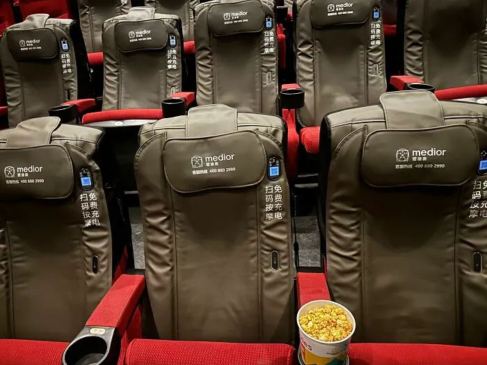 Ingenious things: movie theater rows equipped with leather massage chairs for comfortable viewing.