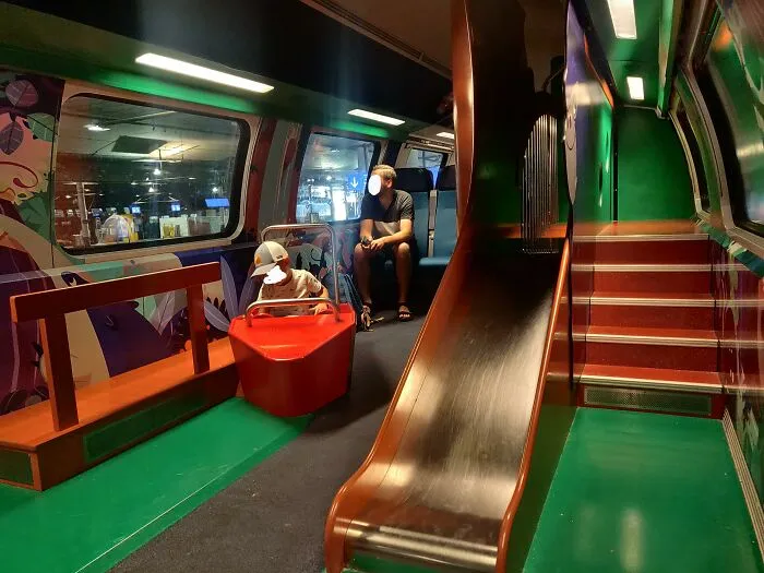 Train carriage with a playground slide showing ingenious things in other countries