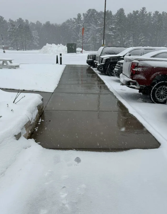 Heated sidewalk clear of snow, one of many ingenious things in various parts of the world.