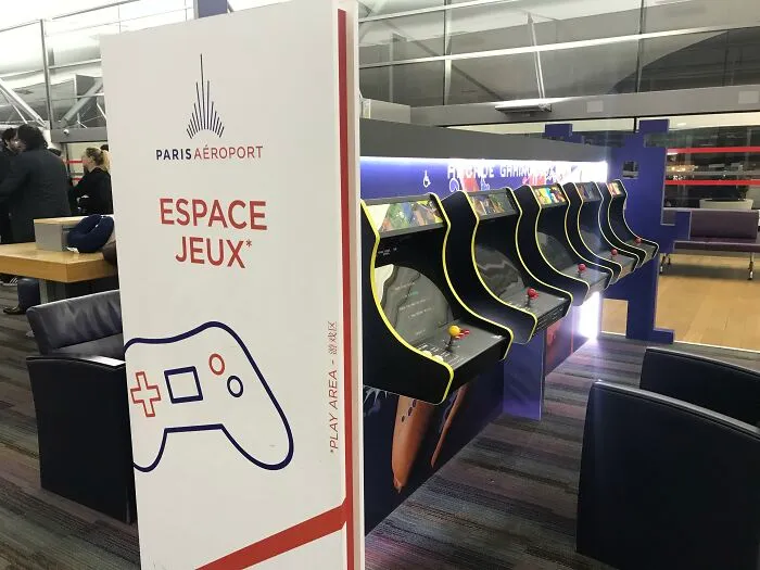 An arcade gaming zone inside Paris airport showing ingenious things in various parts of the world for travelers.