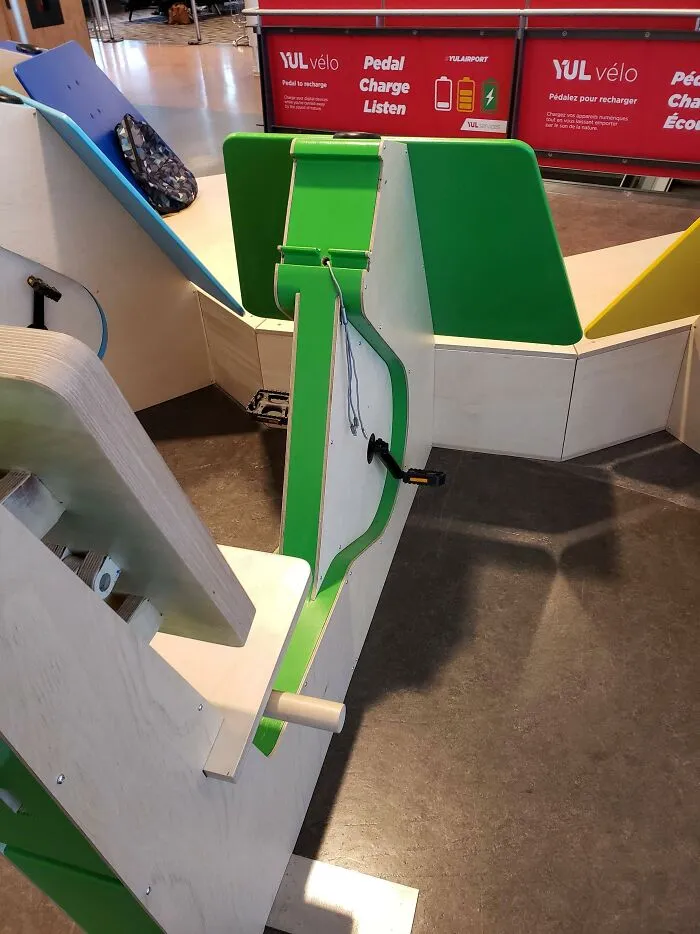An ingenious pedal-powered phone charging station installed at an airport terminal.
