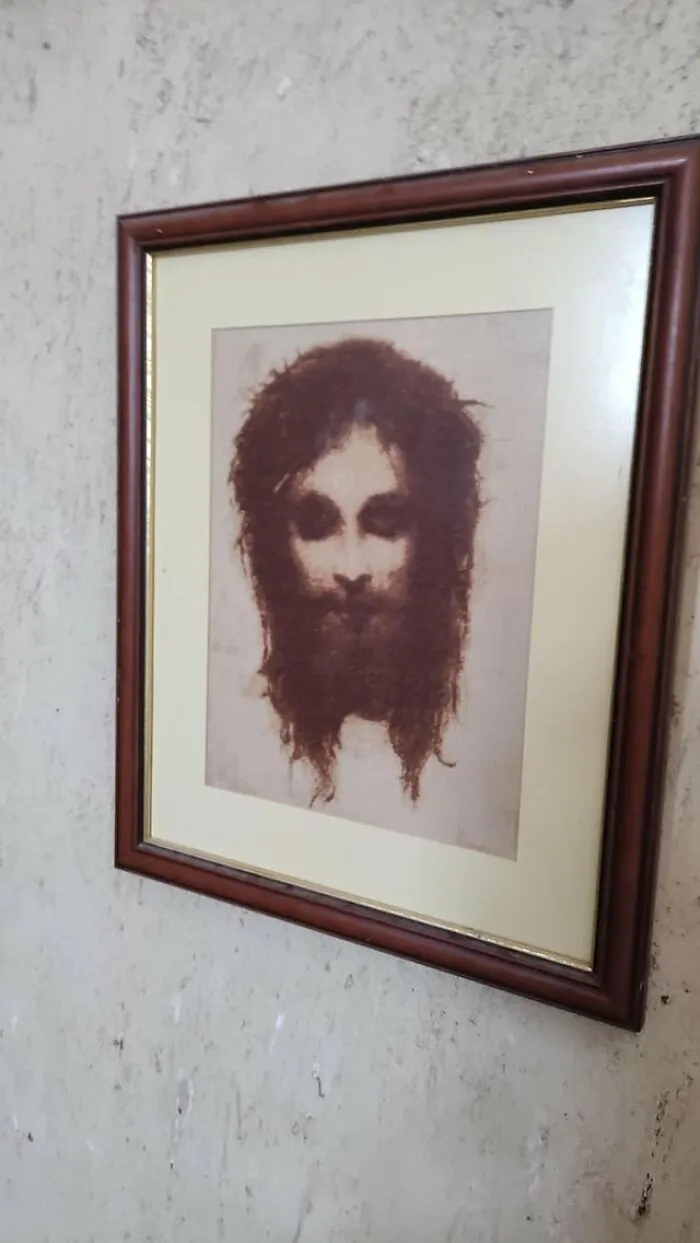 A dark framed portrait with dark eyes included in creepy photos