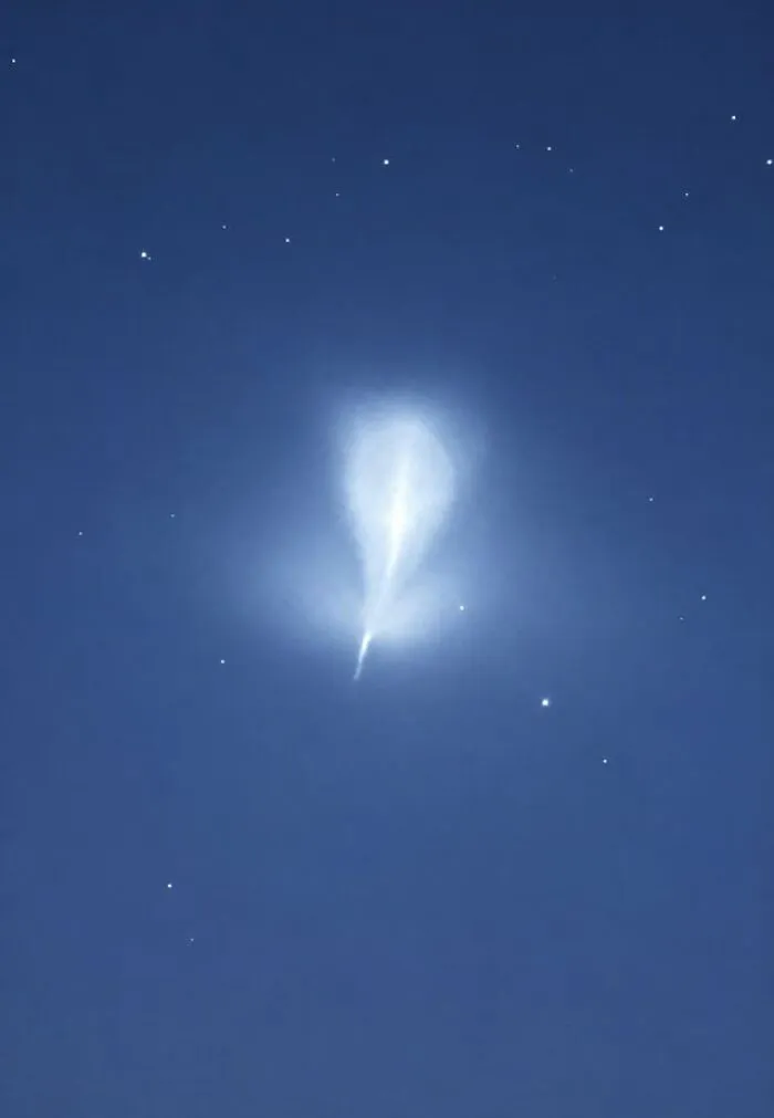 Eerie glowing light in the dark night sky, part of creepy photos.