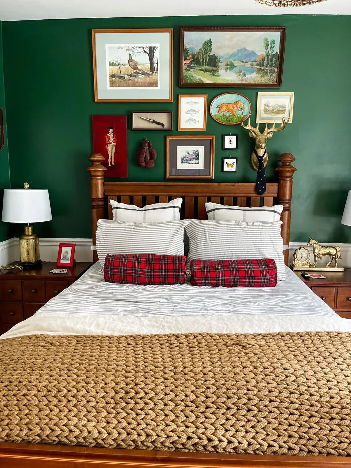 Cozy bedroom makeover featuring a dark green gallery wall above the bed.