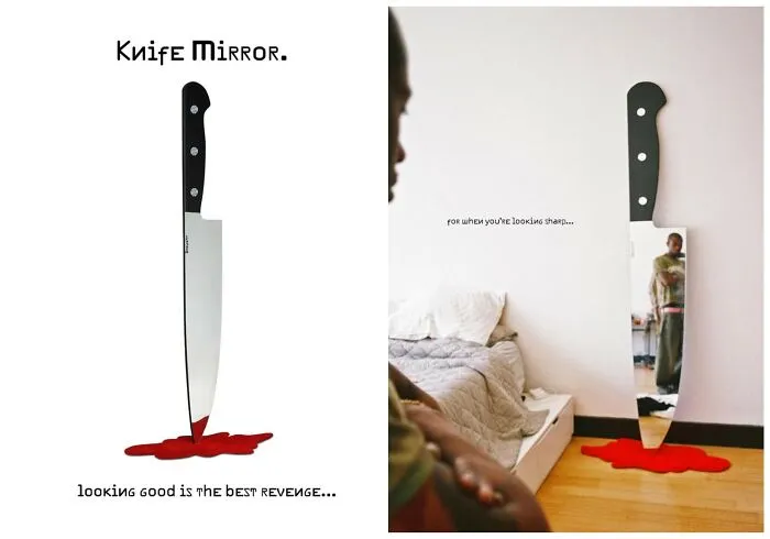 Giant knife-shaped floor mirror with red puddle rug, early internet nostalgia