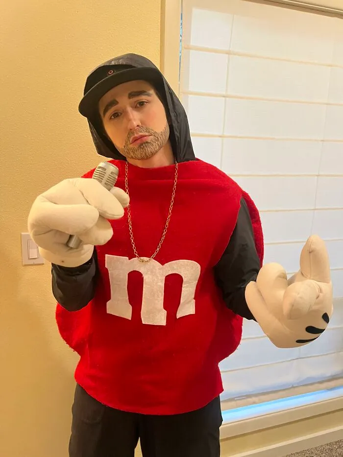 Creative Halloween costume idea showing person dressed as rapper Eminem as M&M candy