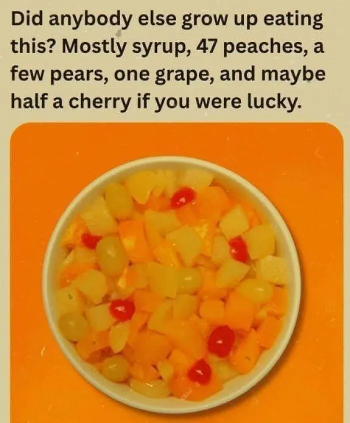 A bowl of canned fruit cocktail mix featured in nostalgic photos from 80s kids childhoods.