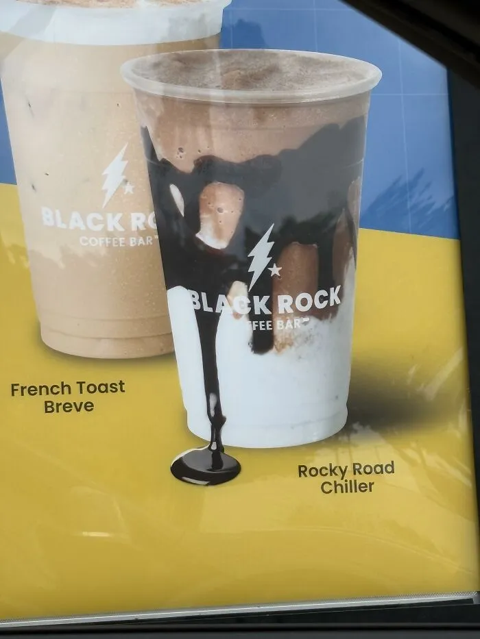 Coffee shop menu board with misleading chocolate drip design as advertising fails