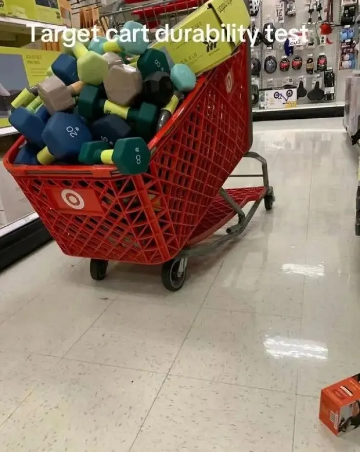 Target shopping cart overloaded with heavy dumbbells testing cart durability